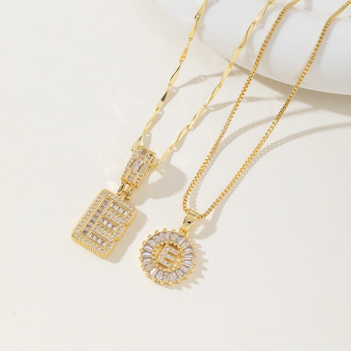 A 26-letter zirconia pendant inlaid with rock sugar copper