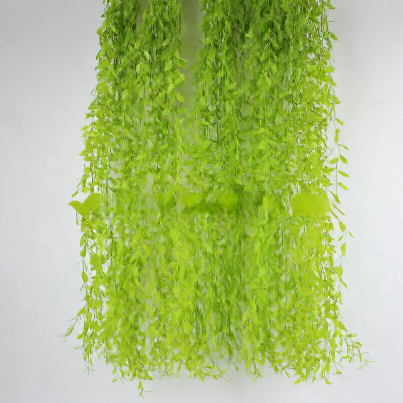 Artificial willow leaves decorate willow twigs