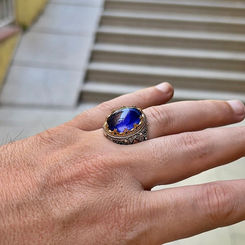 Diamond-encrusted blue gemstone carved ring
