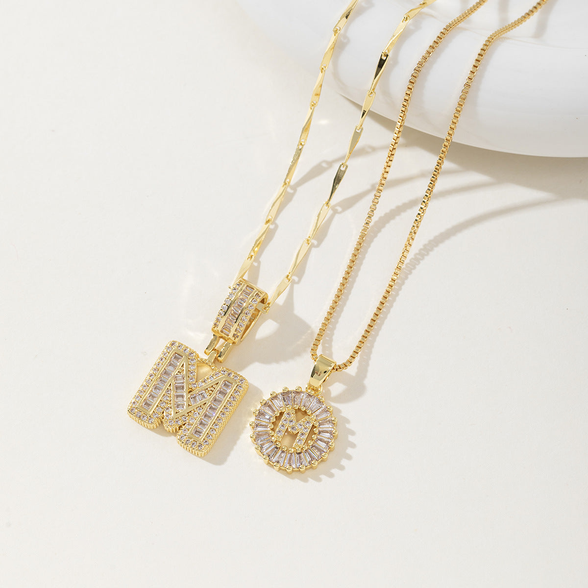 A 26-letter zirconia pendant inlaid with rock sugar copper
