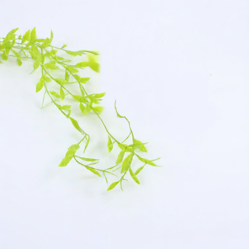 Artificial willow leaves decorate willow twigs