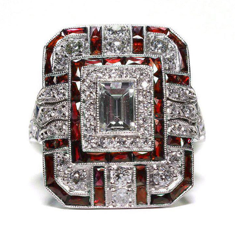 Artificial zircon ring with slightly set diamonds