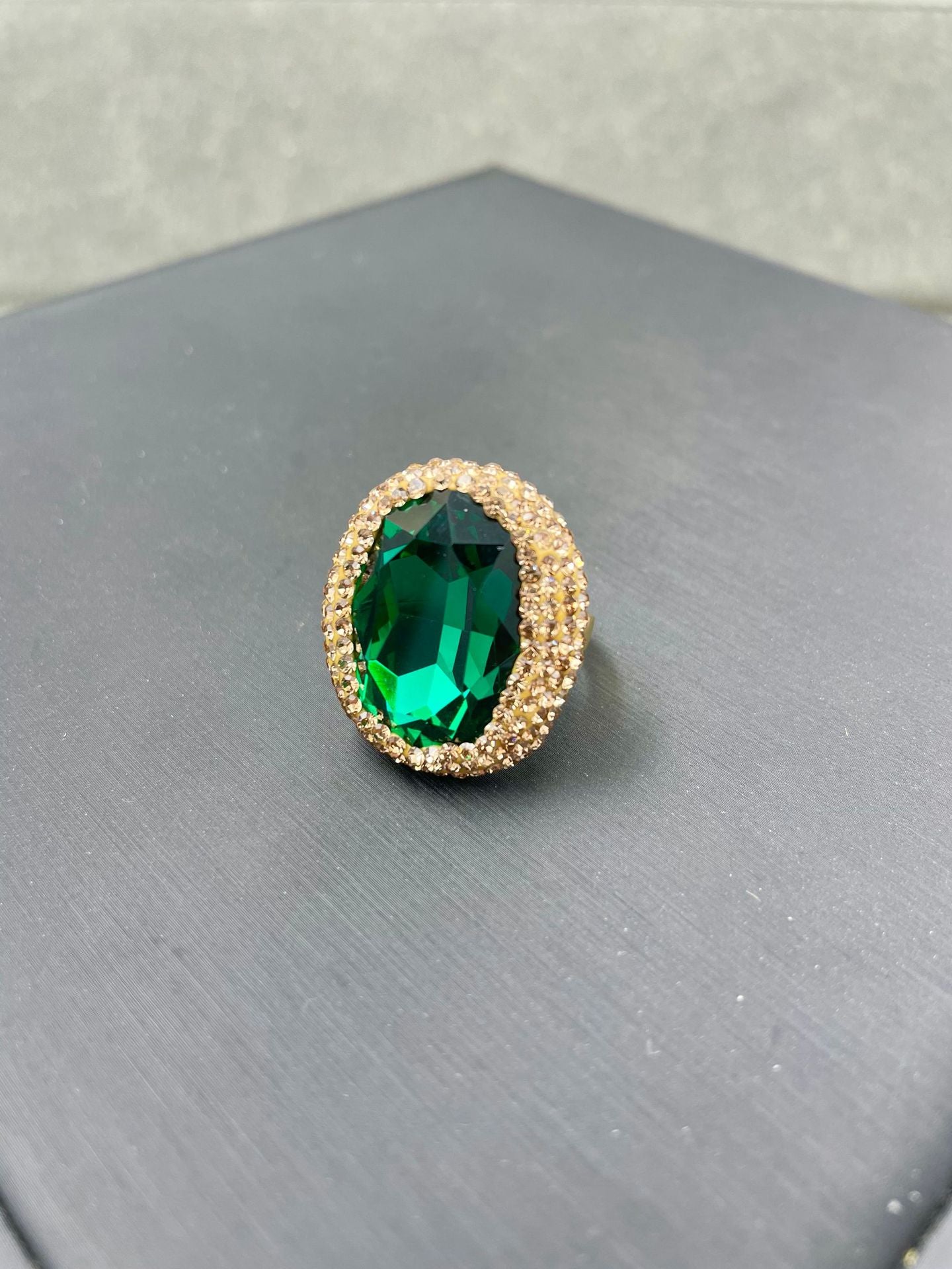 The crystal ring is emerald green