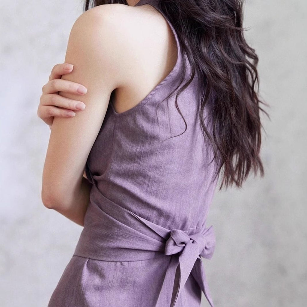 A stylish purple V-neck halter-neck long dress with a lace-up design for women