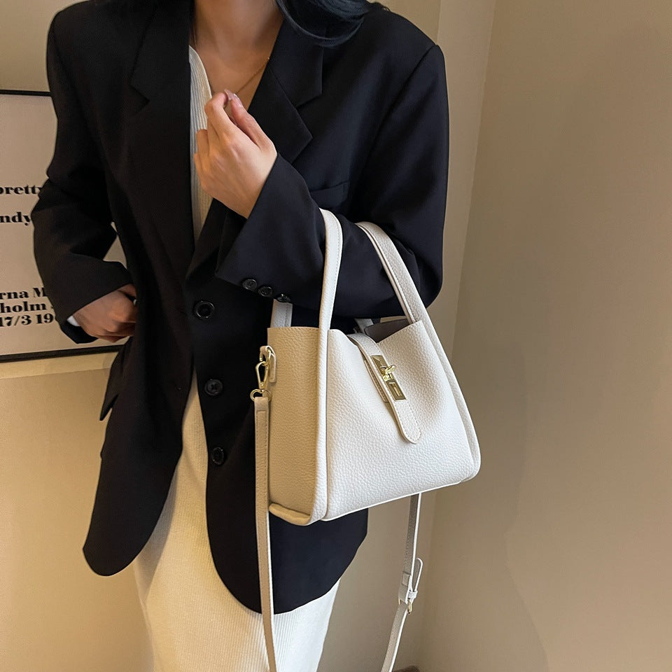 Basket-shaped shoulder bag with a water bucket attached