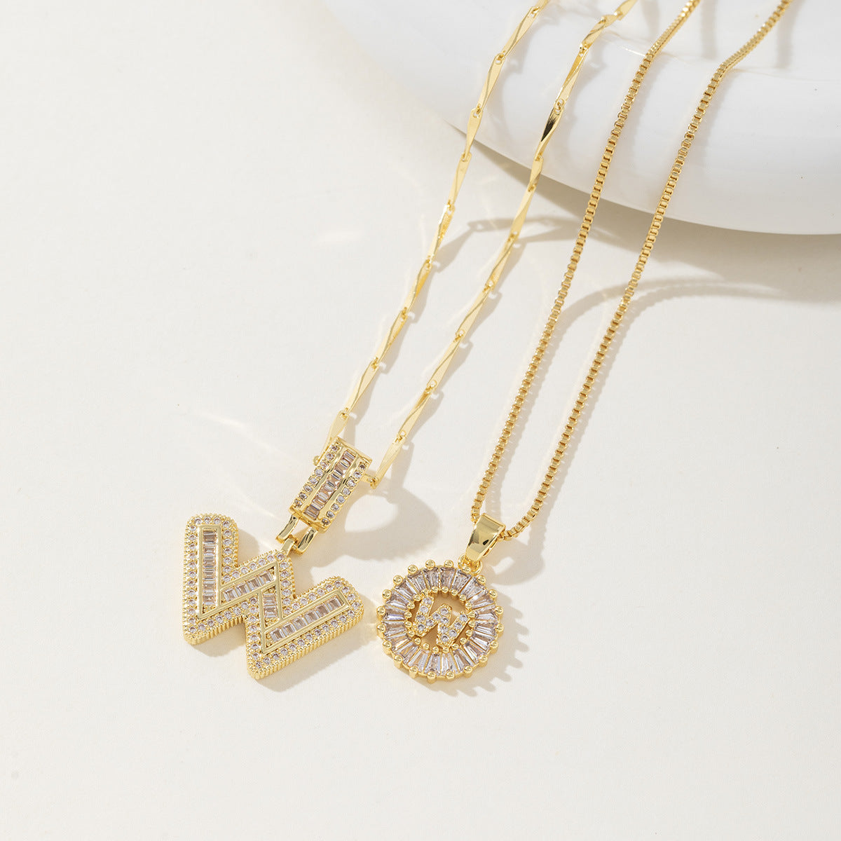 A 26-letter zirconia pendant inlaid with rock sugar copper