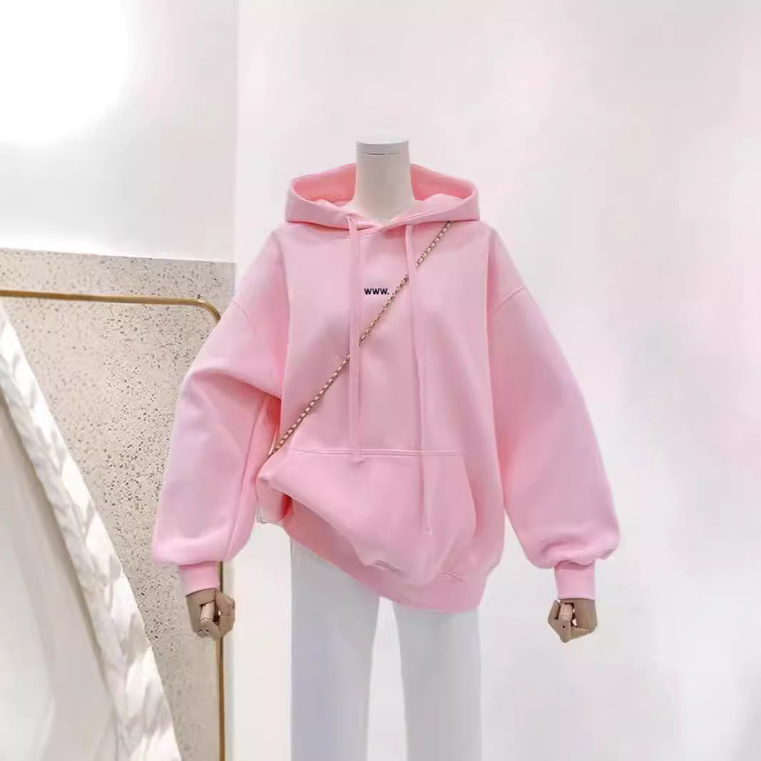 A loose pink hooded sweatshirt for women
