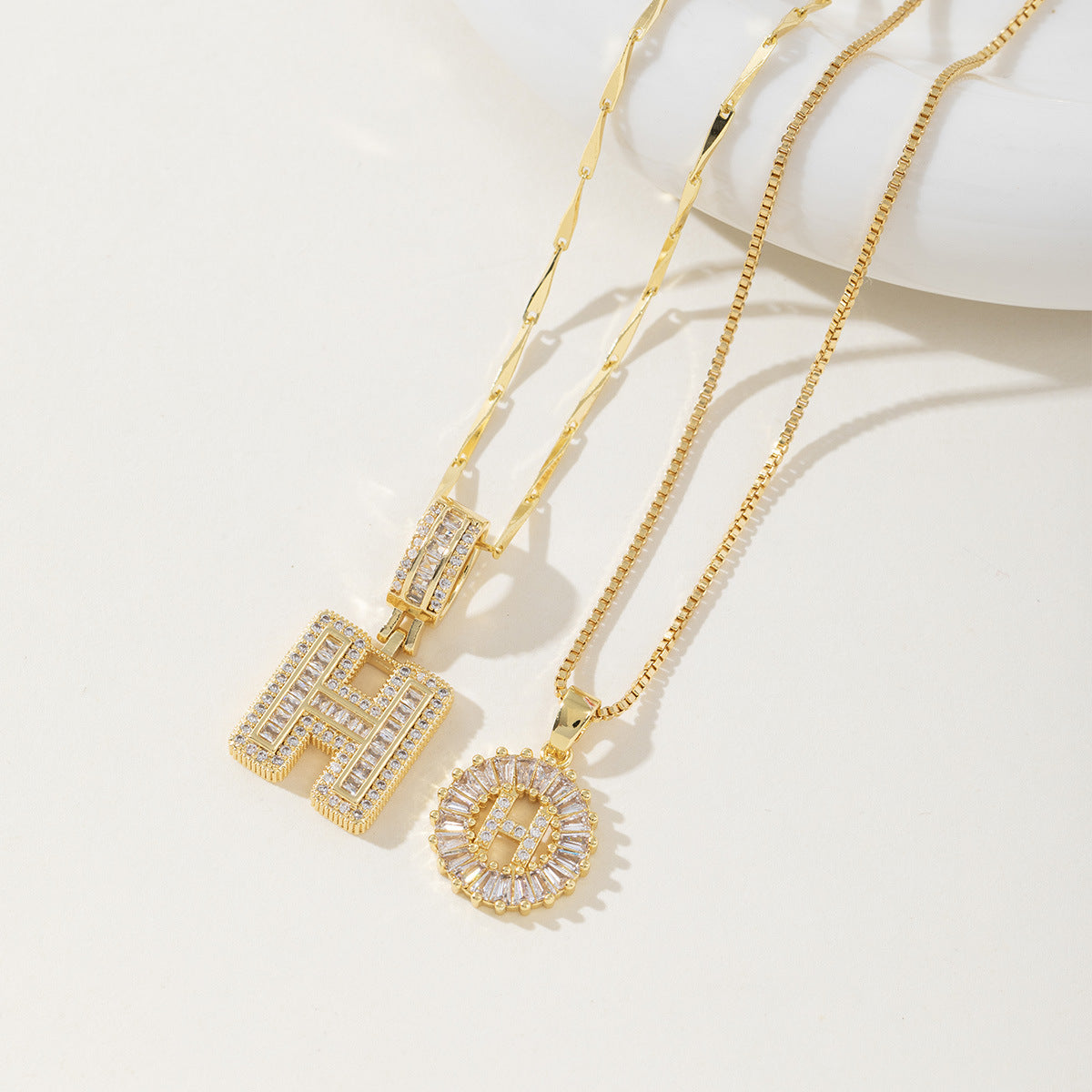 A 26-letter zirconia pendant inlaid with rock sugar copper