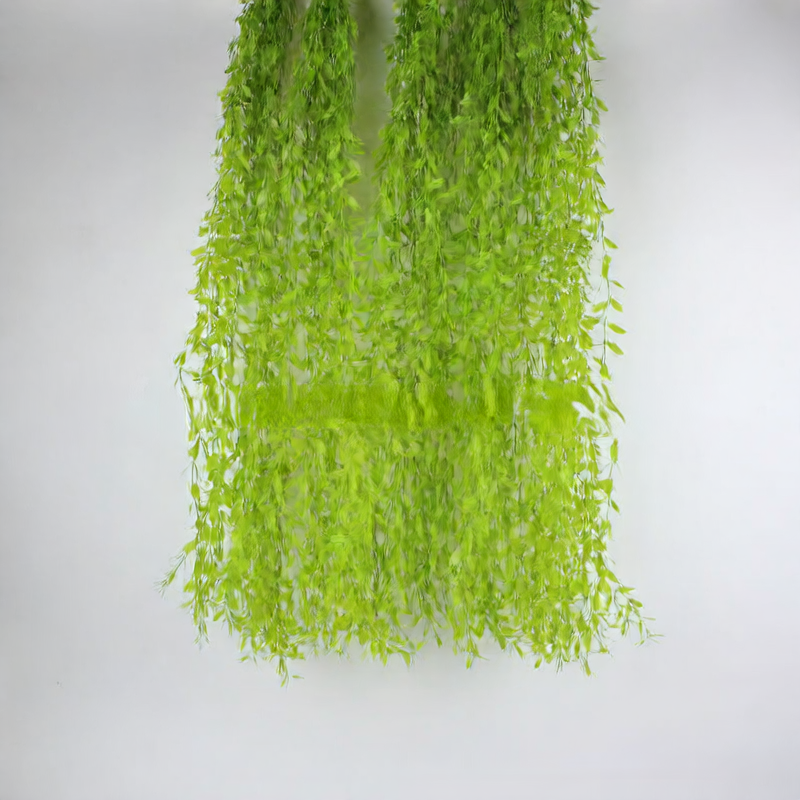 Artificial willow leaves decorate willow twigs