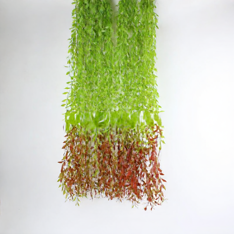Artificial willow leaves decorate willow twigs