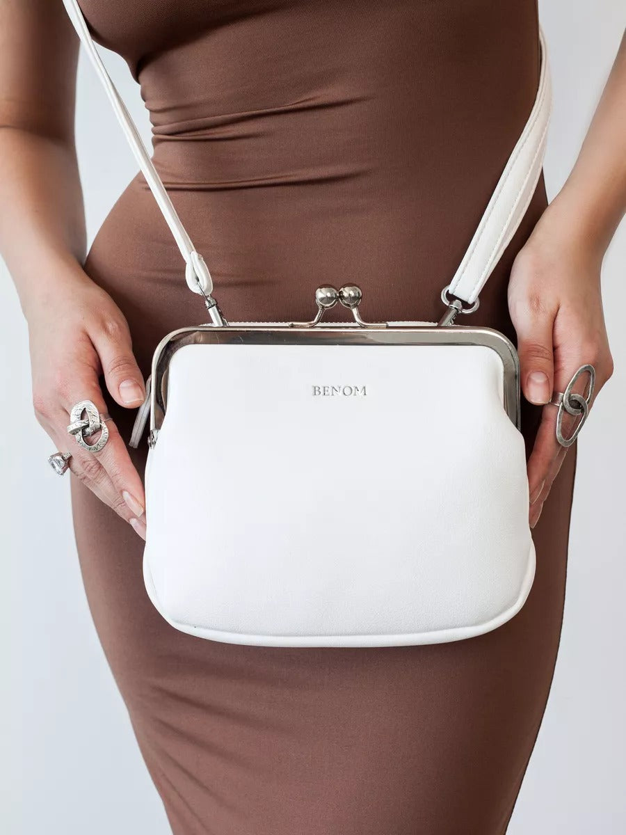 Carry a crossbody bag on one shoulder