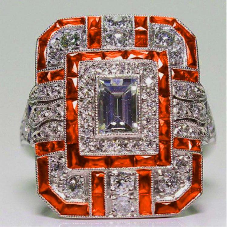 Artificial zircon ring with slightly set diamonds