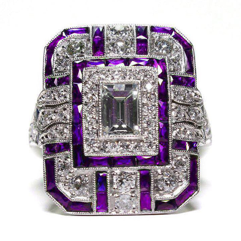 Artificial zircon ring with slightly set diamonds