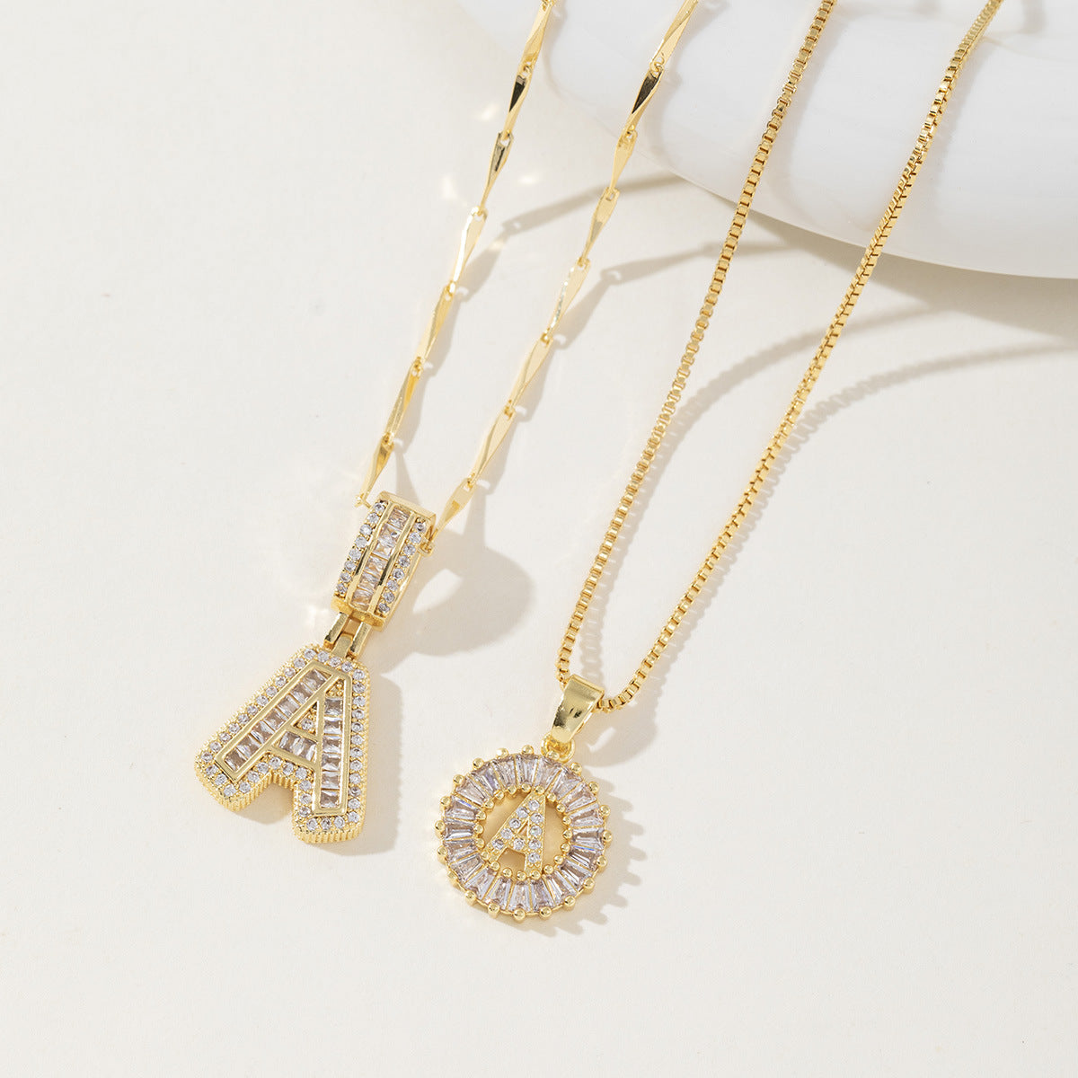 A 26-letter zirconia pendant inlaid with rock sugar copper