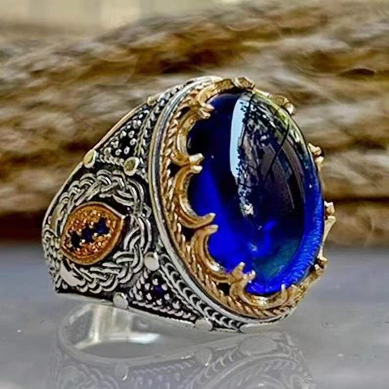Diamond-encrusted blue gemstone carved ring