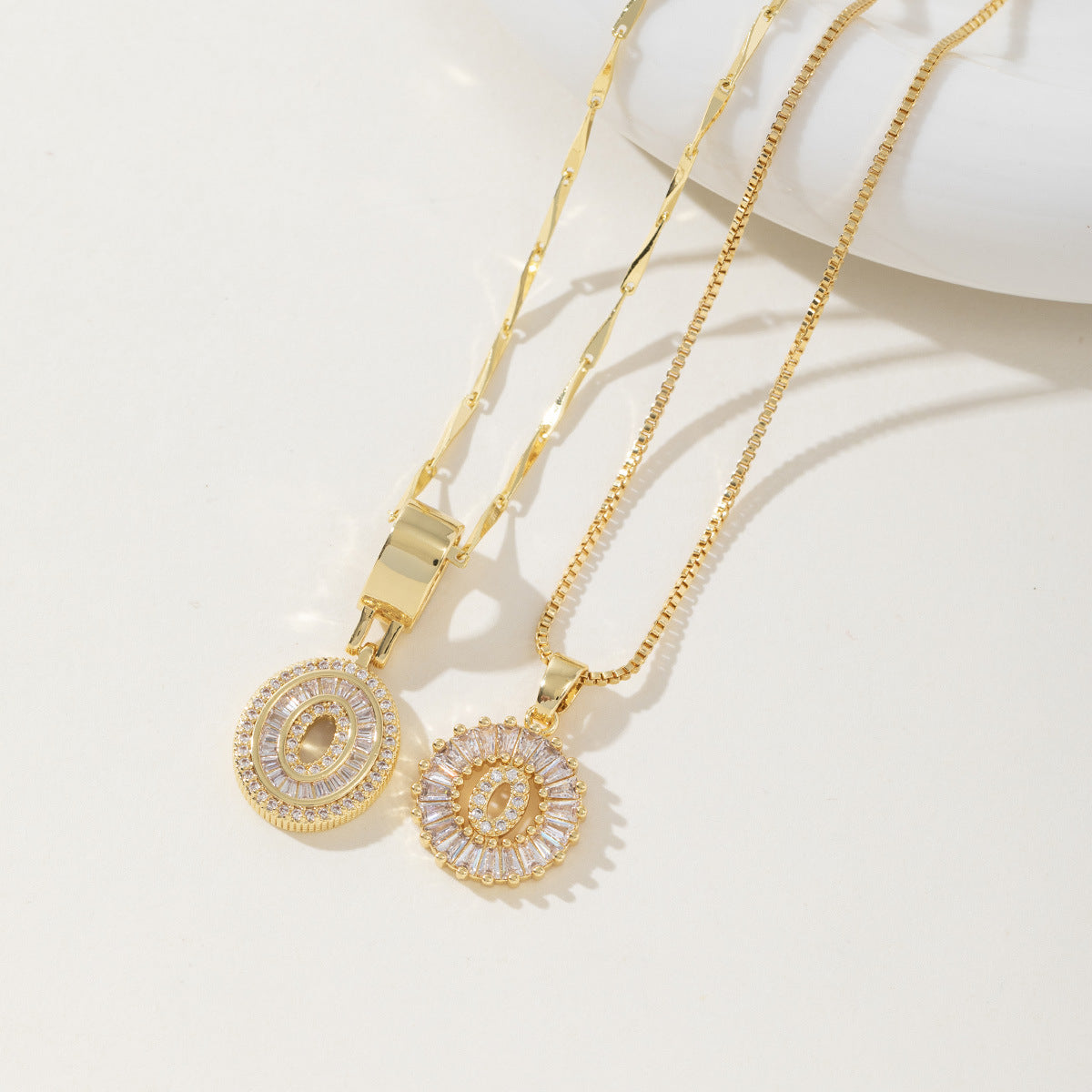 A 26-letter zirconia pendant inlaid with rock sugar copper