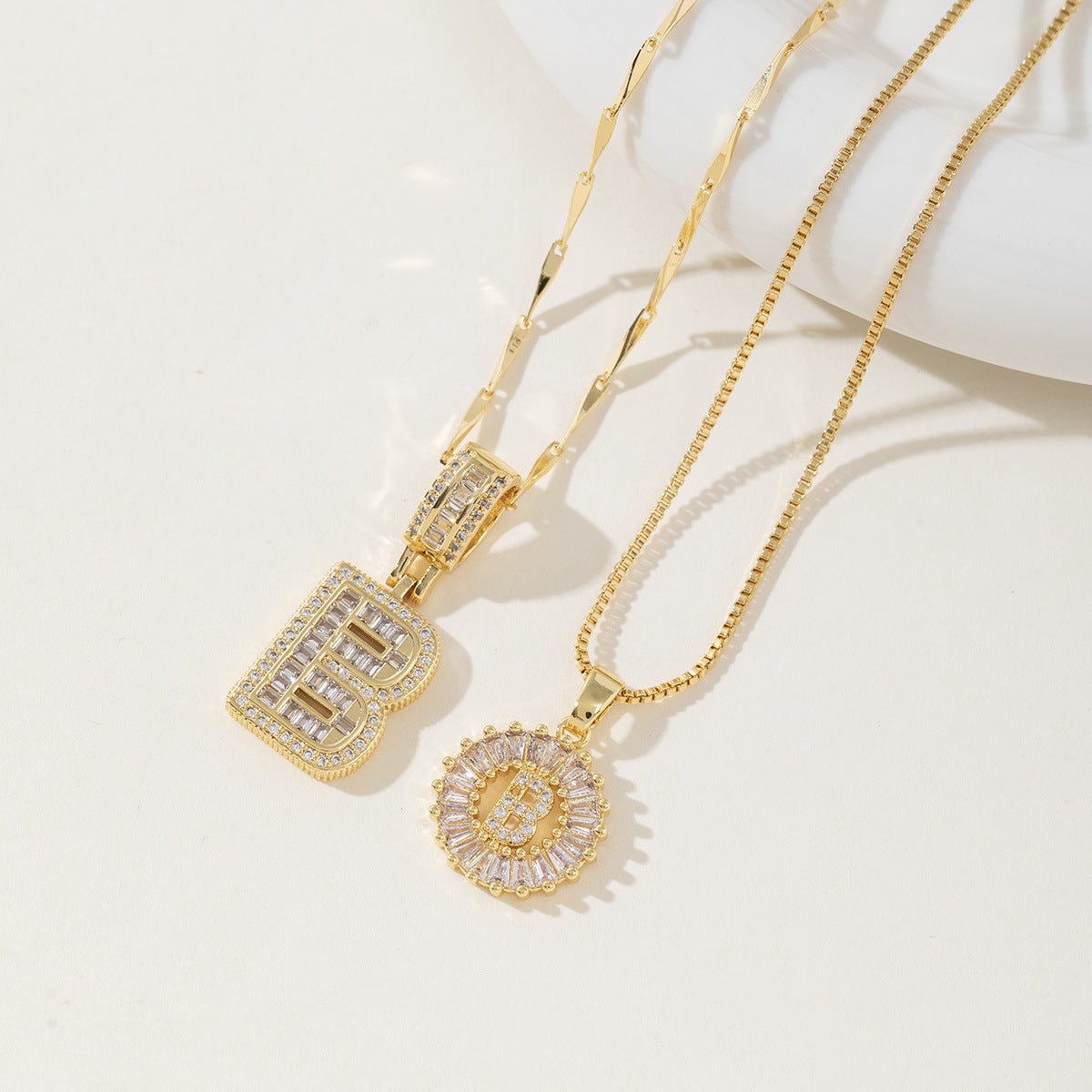 A 26-letter zirconia pendant inlaid with rock sugar copper