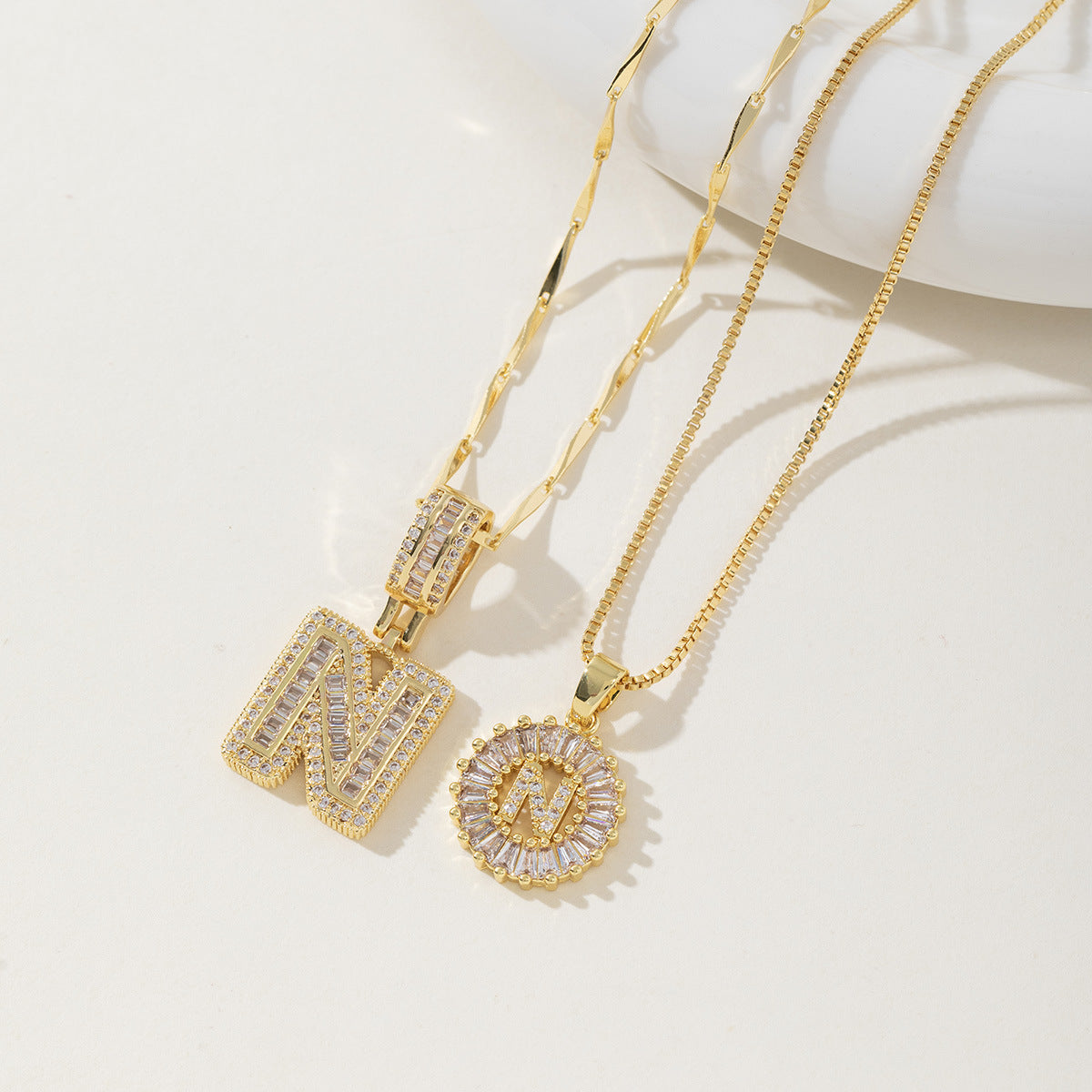 A 26-letter zirconia pendant inlaid with rock sugar copper