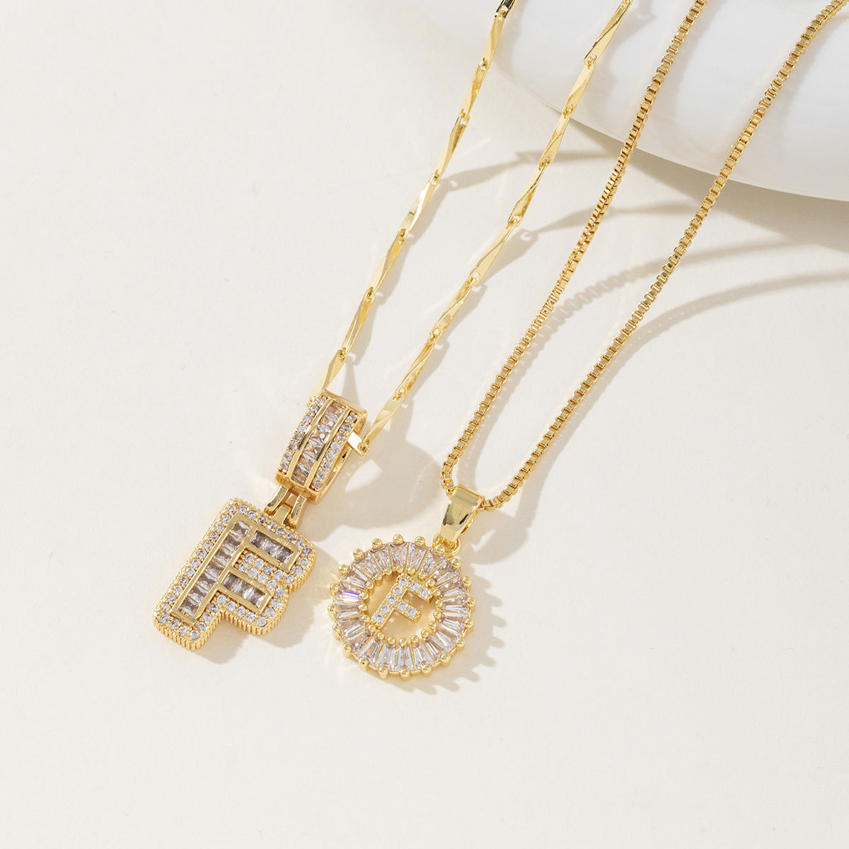 A 26-letter zirconia pendant inlaid with rock sugar copper