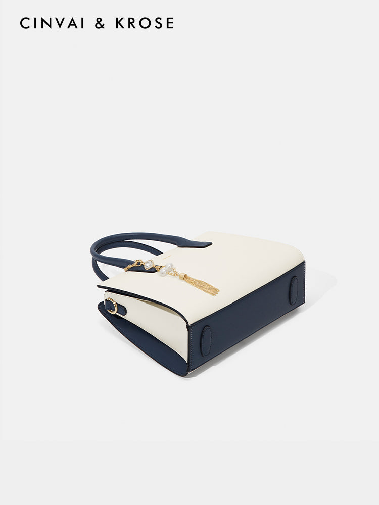 Hand-held shoulder-sling bag