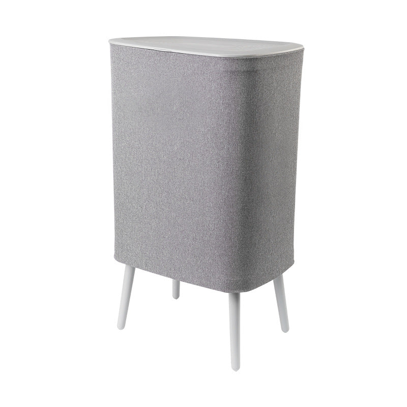 A covered dirty clothes basket