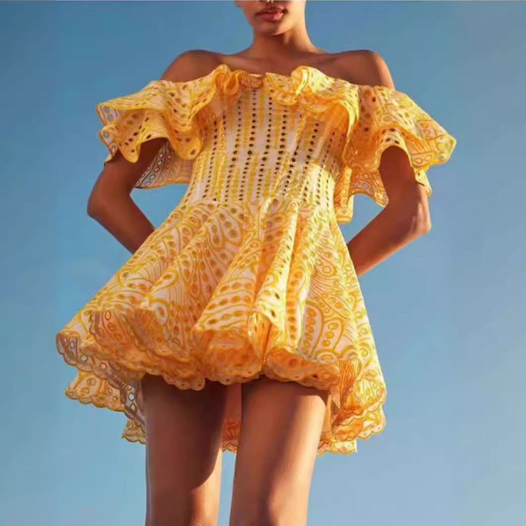 A slimming dress with embroidered cutout and a cinched waist