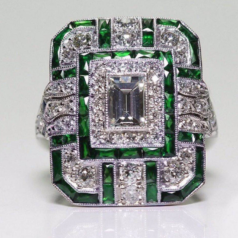Artificial zircon ring with slightly set diamonds