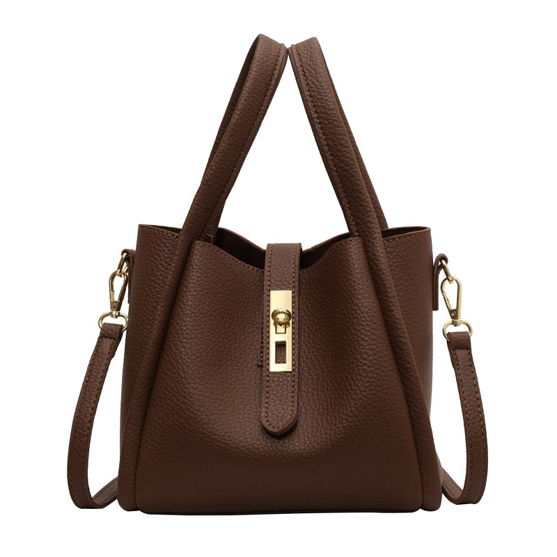 Basket-shaped shoulder bag with a water bucket attached