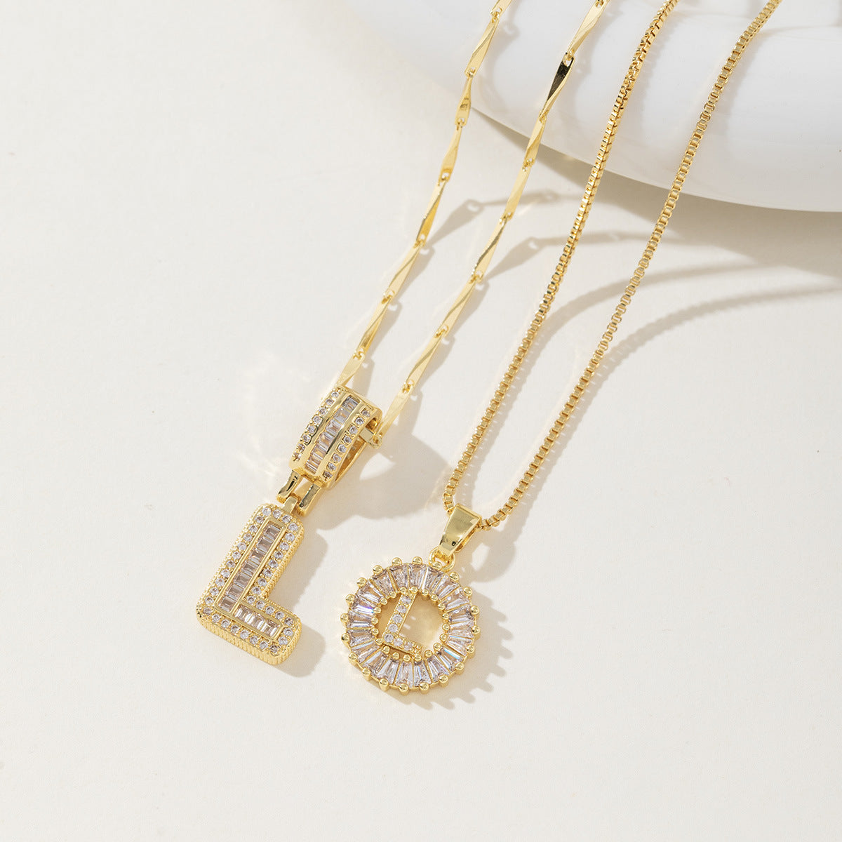 A 26-letter zirconia pendant inlaid with rock sugar copper